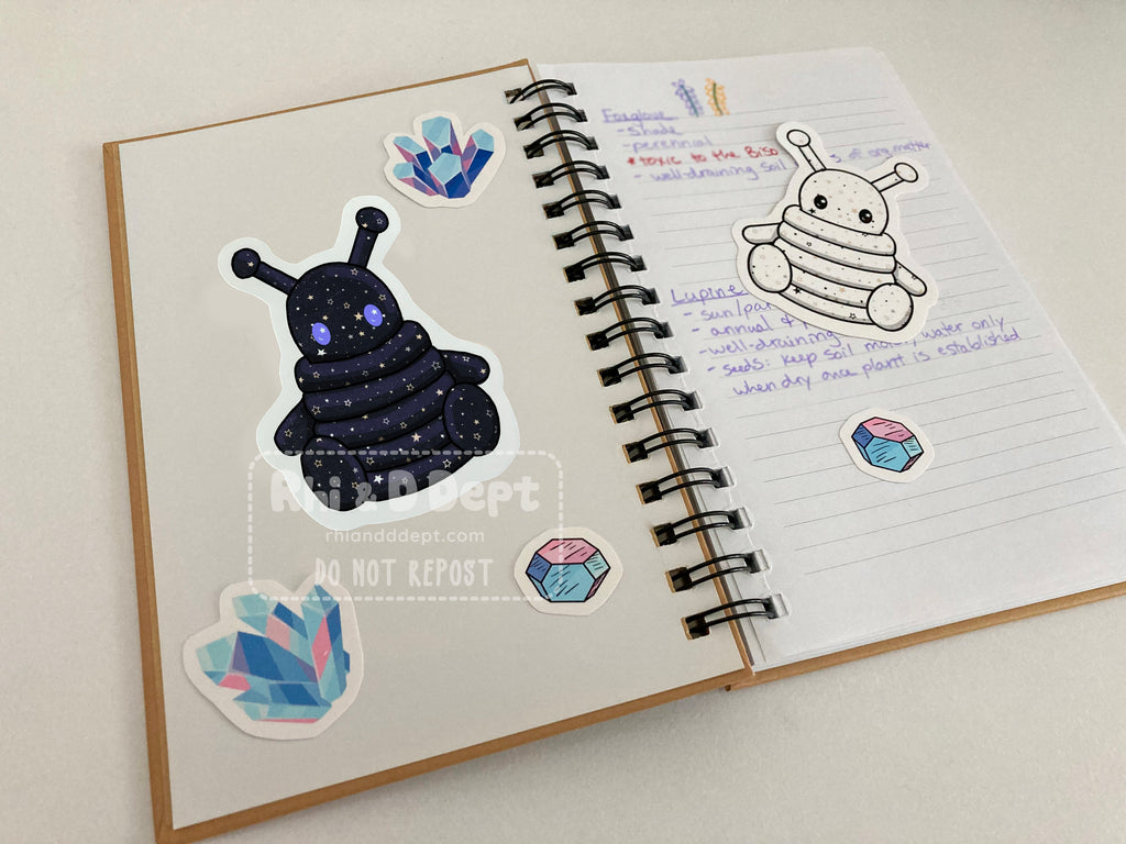 Cute alien stickers on a notebook.