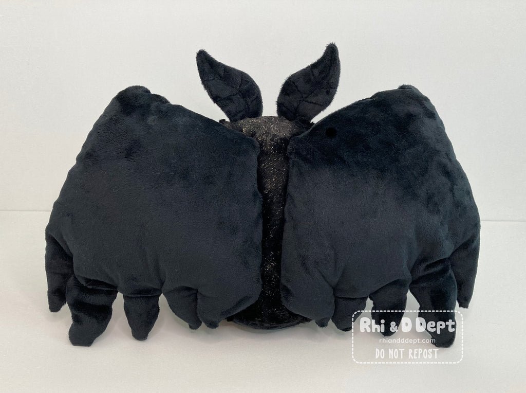 Jumbo sized cute mothman plush made by Rhi & D Dept plush artists.