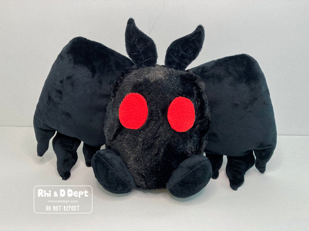 Jumbo sized cute mothman plush made by Rhi & D Dept plush artists.