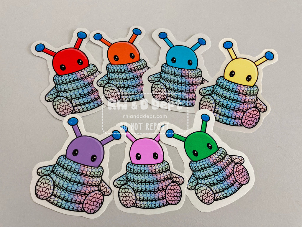 A group of cute rainbow alien vinyl stickers.